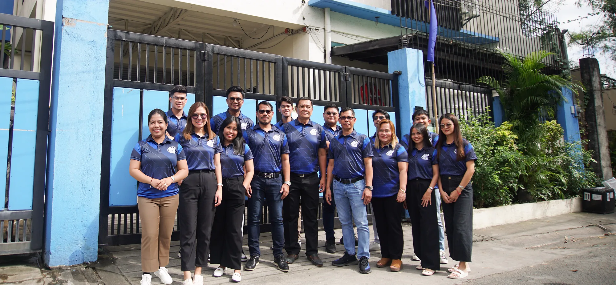 The Medikonstruk team in company polo shirts in front of the office in San Pedro, Laguna